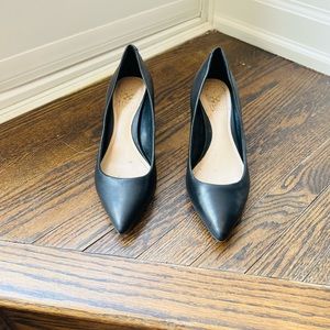 Vince Camuto black leather pumps.